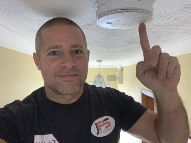 Steve Testing a Smoke Alarm