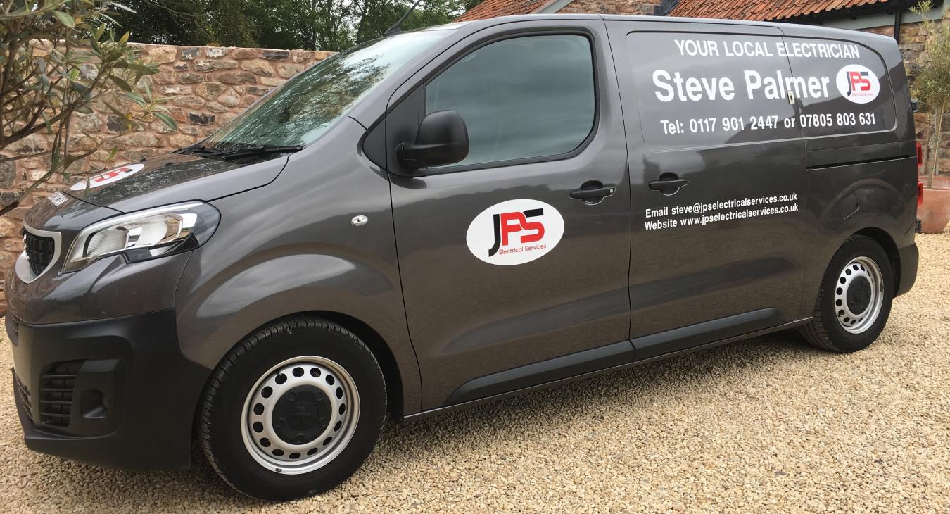 JPS Van parked on a gravel drive